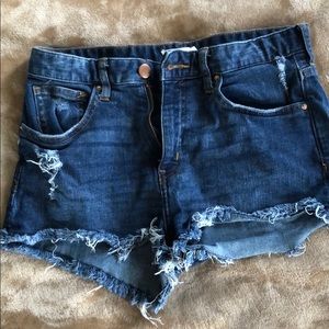 Dark wash destroyed jean shorts
